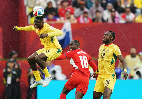 Ghana's Jonas Adjetey (4) heads the ball as Panama's Cecilio Waterman (18) and Ghana's Jerome Opoku look on during the World Cup Group L soccer match between Ghana and Panama in Toronto,