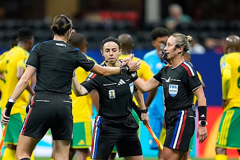 Referee Tori Penso, right, shakes hands with assistant referees Kathryn Nesbitt, left, and Brooke Mayo, during the World Cup Group A soccer match between Czechia and South Africa in Atlanta, Thursday, June 18, 2026.