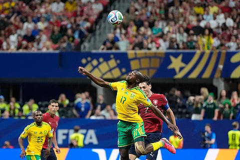 South Africa's Evidence Makgopa jumps for the ball with Czechia's Ladislav Krejci, right, during the World Cup Group A soccer match between Czechia and South Africa in Atlanta, Thursday, June 18, 2026.