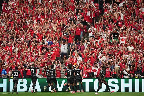 Canada celebrates after scoring their opening goal during the World Cup Group B soccer match against Qatar in Vancouver, British Columbia, Thursday, June 18, 2026.
