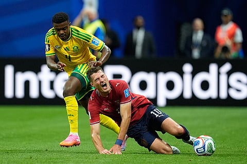Czechia's Patrik Schick falls to the ground in a clash with South Africa's Teboho Mokoena, left, during the World Cup Group A soccer match between Czechia and South Africa in Atlanta, Thursday, June 18, 2026.