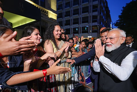 Prime Minister Narendra Modi receives a warm welcome from members of the Indian diaspora, officials and supporters upon his arrival, in Paris, France. 