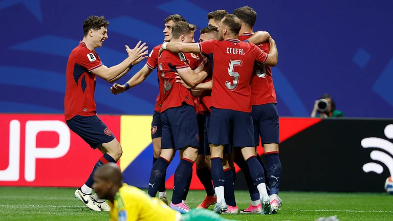 Czechia's Michal Sadilek is mobbed by teammates after scoring the opening goal for their team during the World Cup Group A soccer match between Czechia and South Africa in Atlanta, Thursday, June 18, 2026. - (AP Photo/Erik S. Lesser)
