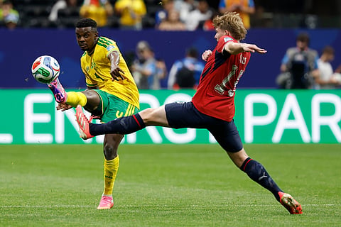 South Africa's Teboho Mokoena, left, passes the ball as Czechia's Pavel Sulc tries to stop him during the World Cup Group A soccer match between Czechia and South Africa in Atlanta, Thursday, June 18, 2026.