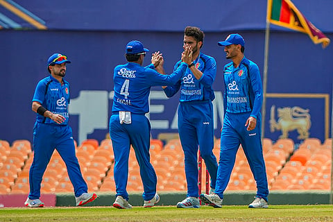 In this image received on June 17, 2026, Afghanistan's players celebrate a wicket during the fifth match between India A and Afghanistan A in the Tri-Nation A Series, in Dambulla, Sri Lanka.