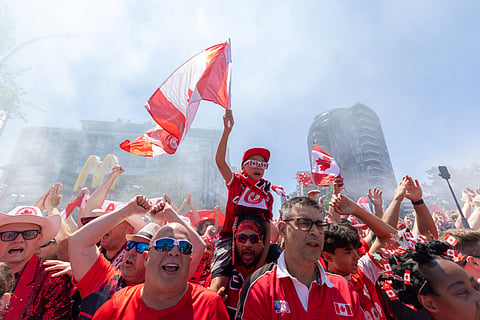 Canada's Voyageurs parade toward B.C. Place ahead of Canada's World Cup Group B soccer match against Qatar, in Vancouver, on Thursday, June 18, 2026.
