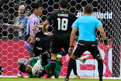 Mexico goalkeeper Raul Rangel (1), left, saves a ball during the World Cup Group A soccer match between Mexico and South Korea in Zapopan, near Guadalajara, Mexico, Thursday, June 18, 2026.