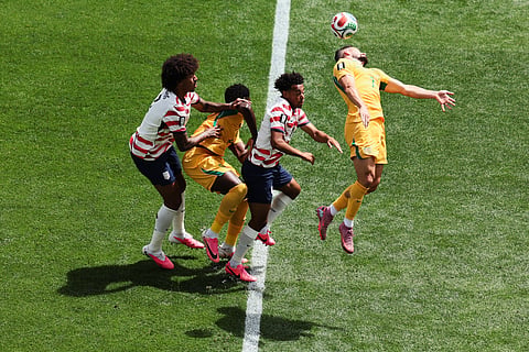 Australia's Mathew Leckie (7) battles for head ball during the World Cup Group D soccer match between the United States and Australia in Seattle, Friday, June 19, 2026.