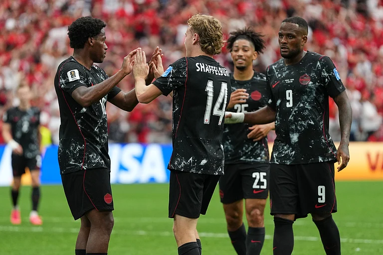Canada's Jonathan David, left, celebrates with teammates after scoring his side's sixth goal for a hat trick during the World Cup Group B soccer match against Qatar in Vancouver, British Columbia, Thursday, June 18, 2026. - AP Photo/Abbie Parr