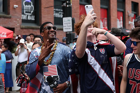 New York Giants quarterback Jameis Winston, left, poses for a selfie with a United States fan outside Seattle Stadium before the World Cup Group D soccer match between the United States and Australia in Seattle, Friday, June 19, 2026.