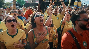 AP Photo/Andres Kudacki : Brazil's fans sing while watching the FIFA World Cup Group C match between Brazil and Morocco during a public watch party in Central Park, Saturday, June 13, 2026, in New York.