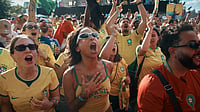 AP Photo/Andres Kudacki : Brazil's fans sing while watching the FIFA World Cup Group C match between Brazil and Morocco during a public watch party in Central Park, Saturday, June 13, 2026, in New York.