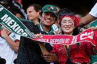 AP Photo/Ricardo Mazalan : A Mexican and a South Korean fan pose for a picture ahead of the World Cup Group A soccer match between Mexico and South Korea in Zapopan, near Guadalajara, Mexico, Thursday, June 18, 2026.