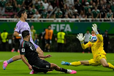 Mexico's Raul Jimenez (9), front, tries a shoot next to South Korea goalkeeper Kim Seung-gyu (1) during the World Cup Group A soccer match between Mexico and South Korea in Zapopan, near Guadalajara, Mexico, Thursday, June 18, 2026.