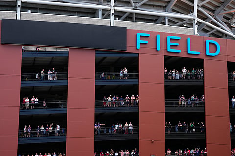 Fans at the stadium watch others outside arriving for the World Cup Group D soccer match between the United States and Australia in Seattle, Friday, June 19, 2026.