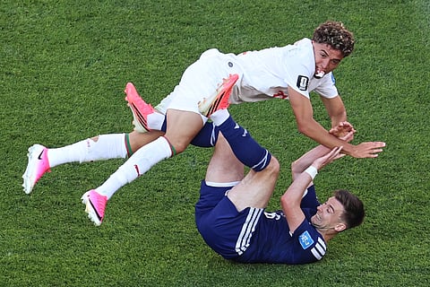 Morocco's Neil El Aynaoui (24) and Scotland's Kieran Tierney (60 collide during the World Cup Group C soccer match between Scotland and Morocco in Foxborough, Mass., near Boston, Friday, June 19, 2026.