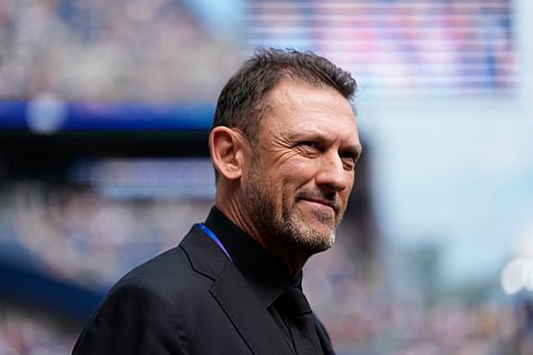 Australia head coach Tony Popovic walks on the field before the World Cup Group D soccer match between the United States and Australia in Seattle, Friday, June 19, 2026.