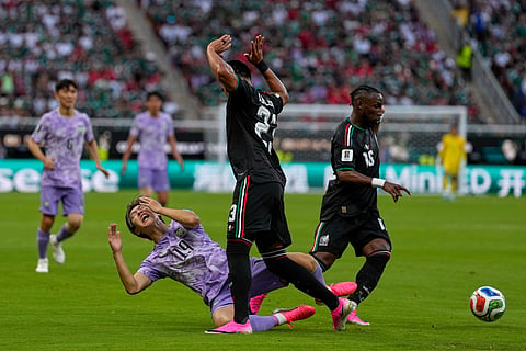 South Korea's Lee Kang-in (19), left, challenges for the ball with Mexico's Jesus Gallardo (23), second right, during the World Cup Group A soccer match between Mexico and South Korea in Zapopan, near Guadalajara, Mexico, Thursday, June 18, 2026.
