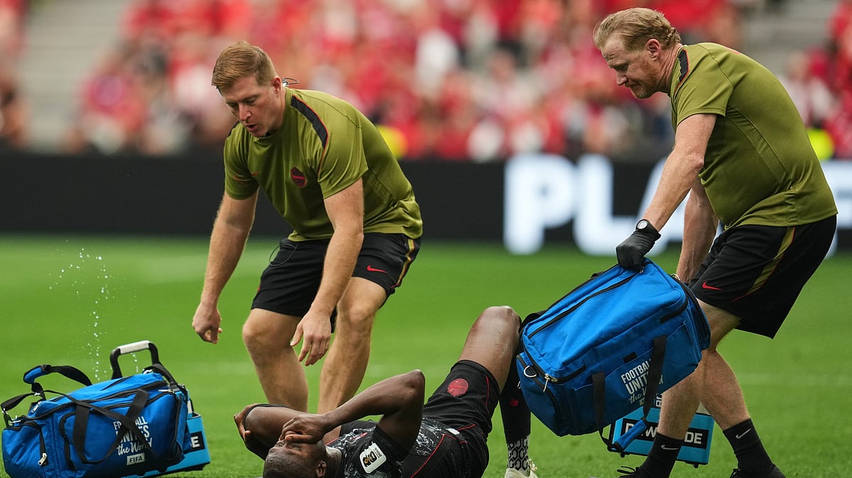 Canada's Ismael Kone, below, recieves medical attention during the World Cup Group B soccer match against Qatar in Vancouver, British Columbia, Thursday, June 18, 2026 - (AP Photo/Abbie Parr)