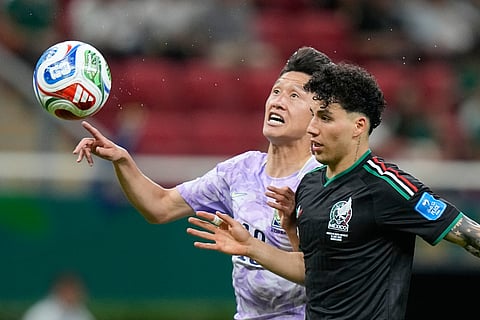 South Korea's Lee Jae-sung (10) and Mexico's Jorge Sanchez (2) battle for the ball during the World Cup Group A soccer match between Mexico and South Korea in Zapopan, near Guadalajara, Mexico, Thursday, June 18, 2026.