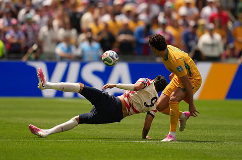 Australia's Alessandro Circati, right, and United States' Ricardo Pepi challenge for the ball during the World Cup Group D soccer match between the United States and Australia in Seattle, Friday, June 19, 2026.