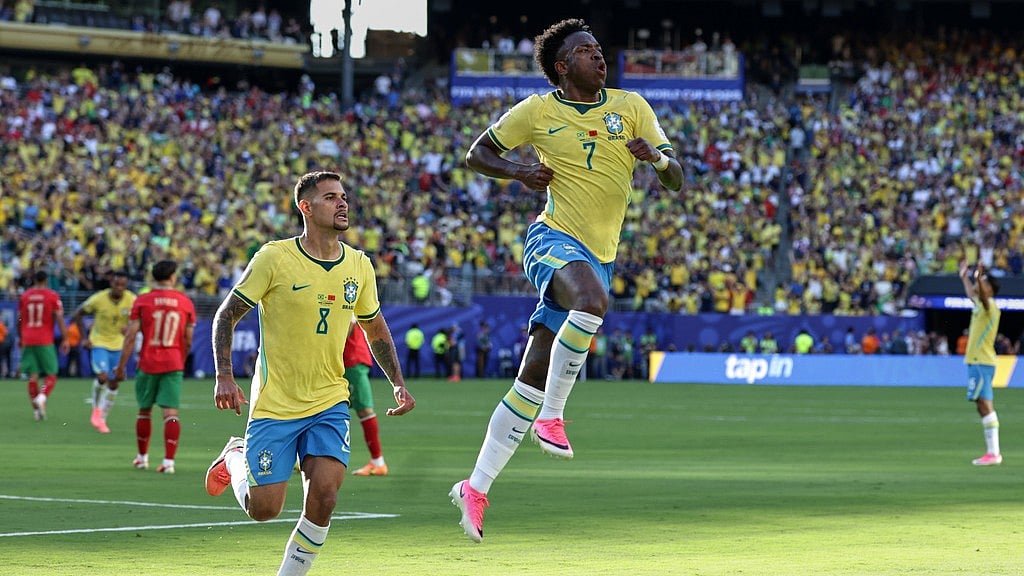 Brazil's Vinicius Junior (7) celebrates with teammate Bruno Guimaraes (8) after scoring during the World Cup Group C soccer match against Morocco in East Rutherford. - AP Photo