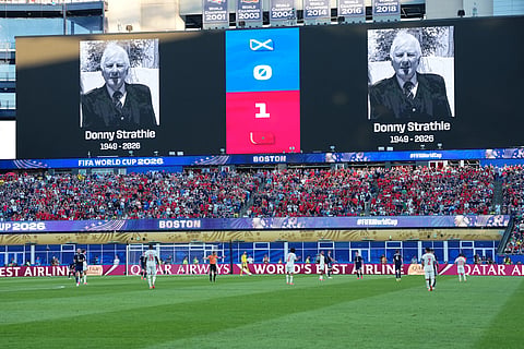 Portraits of Donny Strathie, a Scotland fan who passed away in the last week, are displayed on the screen during the World Cup Group C soccer match between Scotland and Morocco in Foxborough, Mass., near Boston, Friday, June 19, 2026.