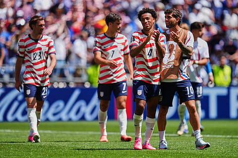 United States' Weston McKennie (8) and United States' Christian Pulisic (10) celebrate after winning the World Cup Group D soccer match against Australia in Seattle, Friday, June 19, 2026.