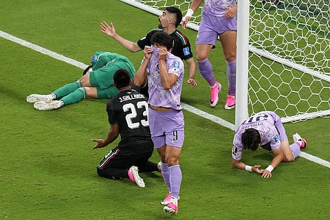 South Korea's Cho Gue-sung (9) and Yang Hyun-jun, bottom right, react after Mexico goalkeeper Raul Rangel, left rear, defended a shot during the World Cup Group A soccer match between Mexico and South Korea in Zapopan, near Guadalajara, Mexico, Thursday, June 18, 2026.