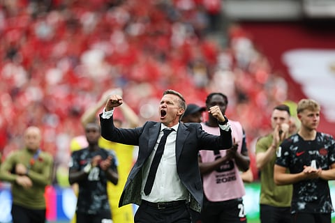 Canada head coach Jesse Marsch celebrates their a 6-0 win after the World Cup Group B soccer match between Canada and Qatar in Vancouver, British Columbia, Thursday, June 18, 2026.