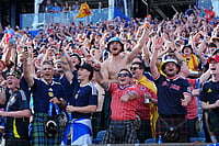 AP Photo/Martin Meissner : Fans of Scotland cheer prior to the World Cup Group C soccer match between Scotland and Morocco in Foxborough, Mass., near Boston, Friday, June 19, 2026.