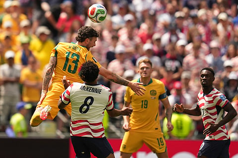 Australia's Aiden O'Neill, left, and United States' Weston McKennie fight for the ball during the World Cup Group D soccer match between the United States and Australia in Seattle, Friday, June 19, 2026.