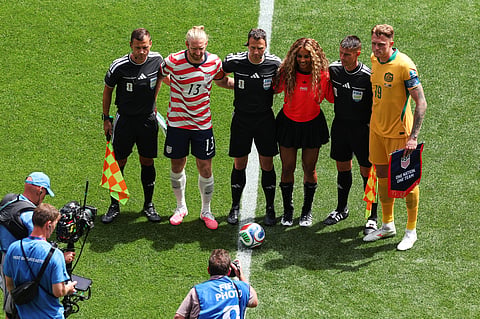 Singer Ciara, second from right, poses with United States' Tim Ream (13), Australia's Harry Souttar (19), referee Felix Zwayer, center of Germany, and his assistants before the World Cup Group D soccer match between the United States and Australia in Seattle, Friday, June 19, 2026.