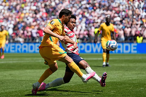 United States' Weston McKennie tries to block a shot from Australia's Jacob Italiano, left, during the World Cup Group D soccer match between the United States and Australia in Seattle, Friday, June 19, 2026.