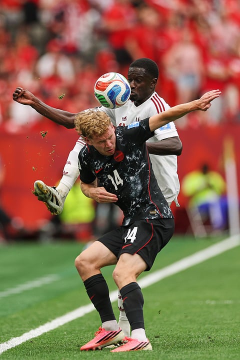 Canada's Jacob Shaffelburg, front, battles with Qatar's Issa Laye (4) during the World Cup Group B soccer match between Canada and Qatar in Vancouver, British Columbia, Thursday, June 18, 2026.
