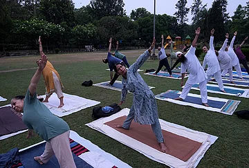 | Photo: PTI/Shiva Sharma : People take part in a yoga session at a garden ahead of the International Yoga Day, in Amritsar, Punjab.