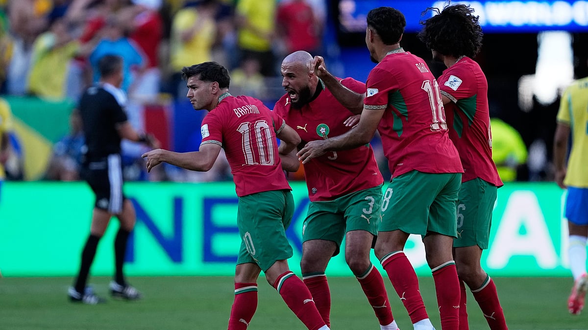 Morocco's Brahim Diaz, left, and teammates celebrate after Ismael Saibari scored the opening goal during the World Cup Group C soccer match between Brazil and Morocco in East Rutherford, N.J., near New York, Saturday, June 13, 2026. - AP Photo/Petr David Josek