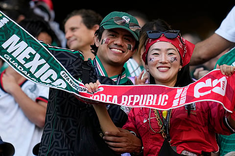 A Mexican and a South Korean fan pose for a picture ahead of the World Cup Group A soccer match between Mexico and South Korea in Zapopan, near Guadalajara, Mexico, Thursday, June 18, 2026.