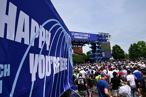 People at a fan festival in Kansas City, Mo., watch a televised World Cup Group D soccer match between the United States and Australia, Friday, June 19, 2026.