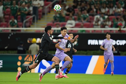 Mexico's Edson Alvarez, left, runs for the ball against South Korea's Son Heung-min during the World Cup Group A soccer match between Mexico and South Korea in Zapopan, near Guadalajara, Mexico, Thursday, June 18, 2026.