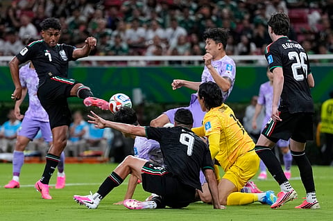Mexico's Luis Romo (7), left, scores the opening goal during the World Cup Group A soccer match between Mexico and South Korea in Zapopan, near Guadalajara, Mexico, Thursday, June 18, 2026.