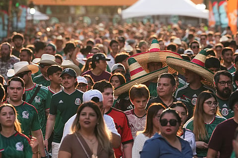 Fans make their way in to the Fan Zone prior to the World Cup soccer match between Mexico and South Korea in Monterrey, Mexico, Thursday, June 18, 2026.
