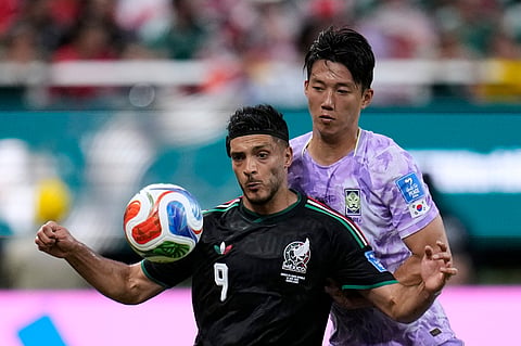 Mexico's Raul Jimenez (9), left, fights for the ball with South Korea's Lee Han-beom (2) during the World Cup Group A soccer match between Mexico and South Korea in Zapopan, near Guadalajara, Mexico, Thursday, June 18, 2026.