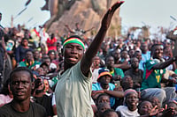 AP Photo/Misper Apawu : A Senegalese fan reacts as he watches a broadcast of the World Cup Group I soccer match between Senegal and France in Dakar, Senegal, Tuesday, June 16, 2026.