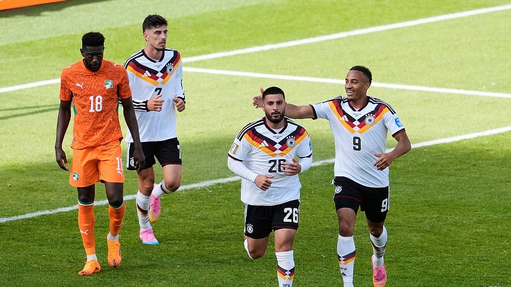 Germany's Deniz Undav (26) celebrates with Jamie Leweling (9) after Undav scored his first goal in the World Cup Group E soccer match between Germany and Ivory Coast in Toronto. - AP Photo/Olivia White