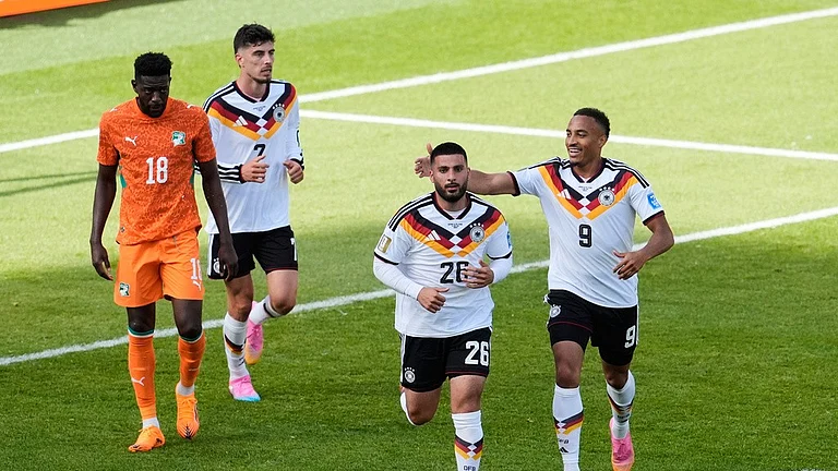 Germany's Deniz Undav (26) celebrates with Jamie Leweling (9) after Undav scored his first goal in the World Cup Group E soccer match between Germany and Ivory Coast in Toronto. - AP Photo/Olivia White