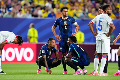 Brazil's Raphinha (11) sits after he injured during the World Cup Group C soccer match between Brazil and Haiti in Philadelphia, Friday, June 19, 2026.
