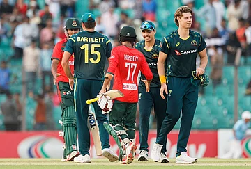 | Photo: AP/Mosaraf Hossain : Bangladesh's captain Towhid Hridoy, center, shakes hands with Australian players after Australia won the second T20 international cricket match against Bangladesh, in Chattogram, Bangladesh.