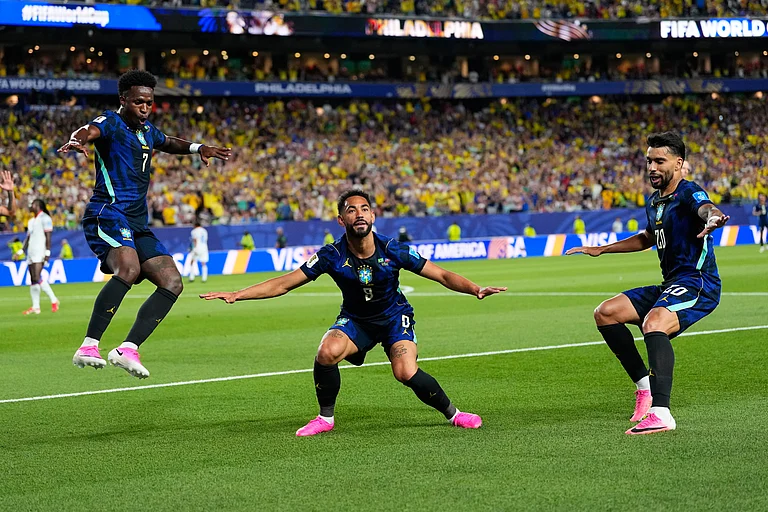 Brazil's Matheus Cunha (9) celebrates after scoring his side's second goal with Brazil's Vinicius Junior (7) and Lucas Paqueta (20) during the World Cup Group C soccer match between Brazil and Haiti in Philadelphia, Friday, June 19, 2026. - AP Photo/Petr David Josek