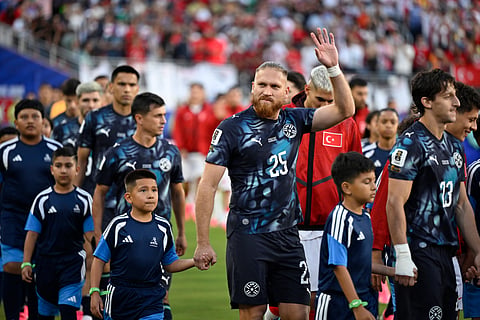 Paraguay's Isidro Pitta (25) is escorted onto the field before the World Cup Group D soccer match between Turkey and Paraguay in Santa Clara, Calif., near San Francisco, Friday, June 19, 2026
